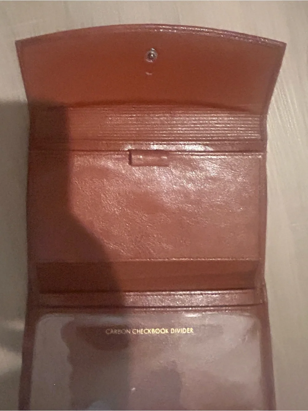 Rolfs brown leather card case with gold detail